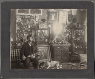 Item #21895 "The Collector" - Mounted Photograph of a Man Surrounded by His Many Collections....