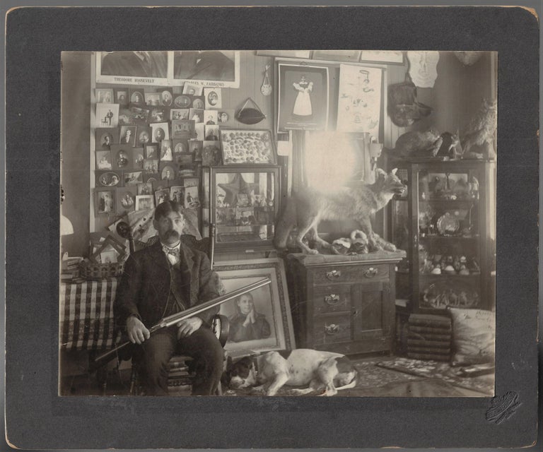 Item #21895 "The Collector" - Mounted Photograph of a Man Surrounded by His Many Collections. Frank E. Joerg.